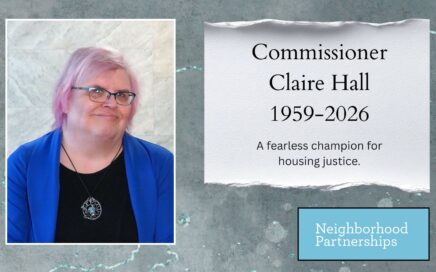 Memorial graphic featuring a portrait of Commissioner Claire Hall, a person with short pink hair and glasses wearing a blue blazer and black top. To the right, text reads: “Commissioner Claire Hall, 1959–2026. A fearless champion for housing justice.” The Neighborhood Partnerships logo appears in the lower right corner.