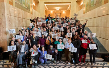 Housing advocates gathered at the Oregon State House holding signs reading 'Every Oregonian deserves a home.'