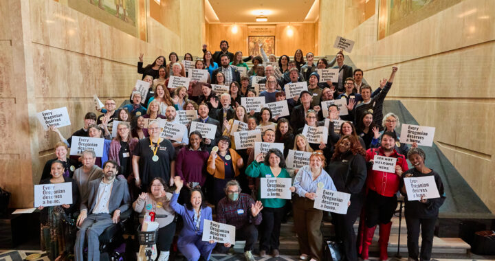 Housing advocates gathered at the Oregon State House holding signs reading 'Every Oregonian deserves a home.'